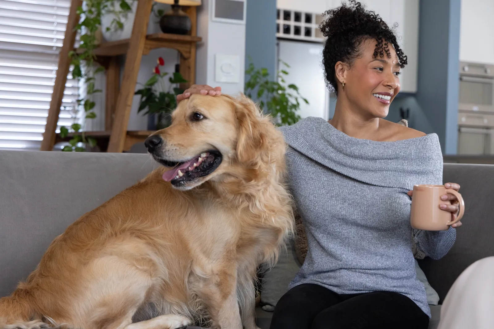 Woman relaxing at home with her emotional support dog